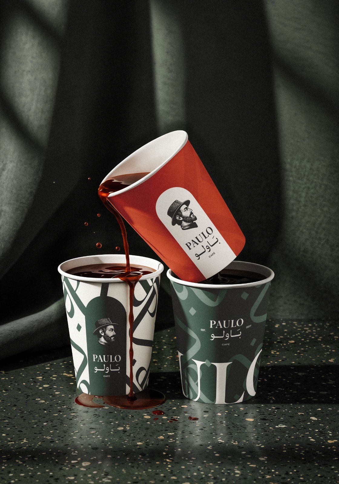 Pouring coffee between Paulo cups